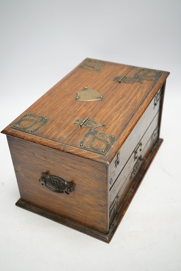 An early 20th century jewellery box and a similar oak stationery casket. Condition - poor